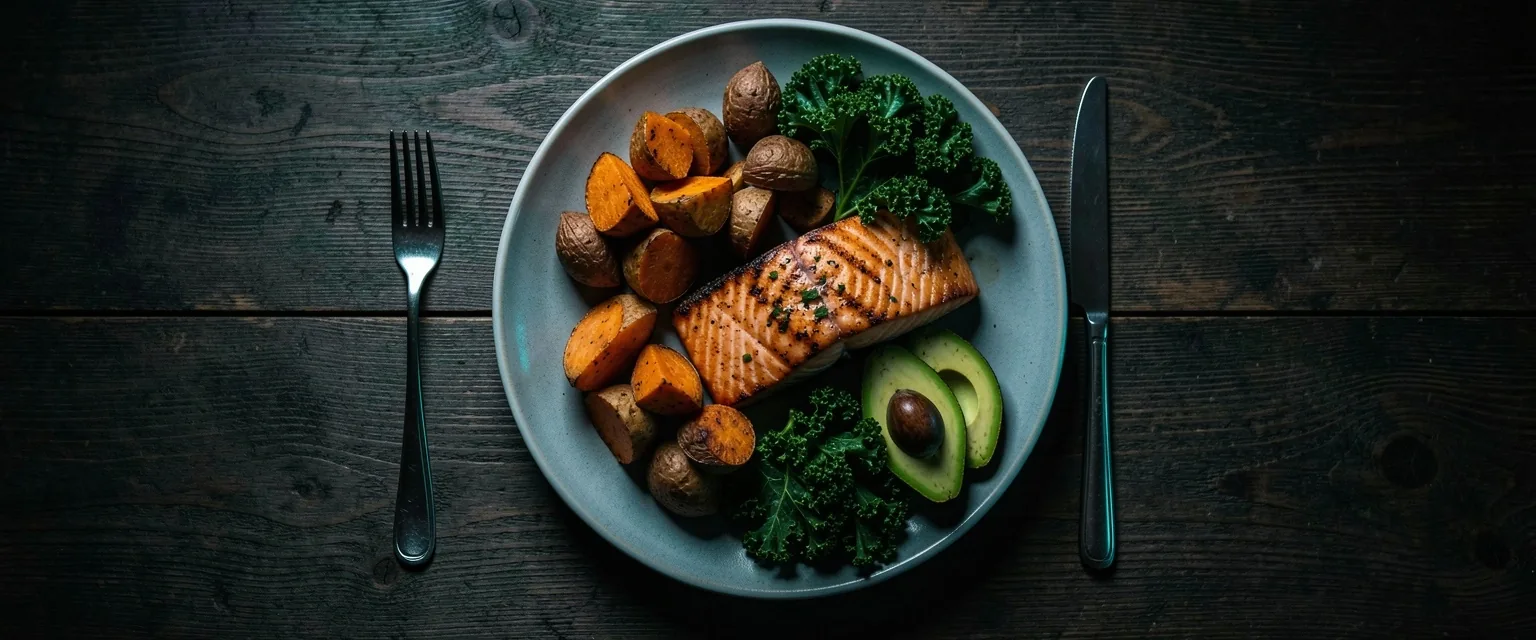 Balanced meal with complex carbohydrates and healthy fats on a dark table